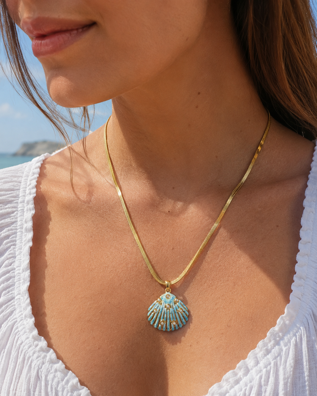 Detail view of Sea Glow Scallop Shell Necklace by AURAM with coastal shell pendant styling