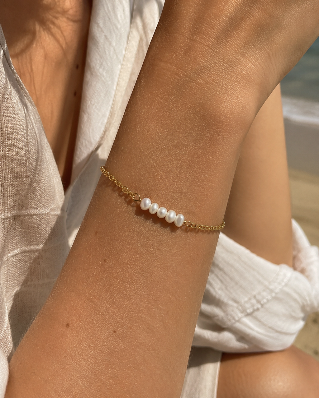 Detail view of A Thread of Light Pearl Bracelet by AURAM with delicate freshwater pearl styling