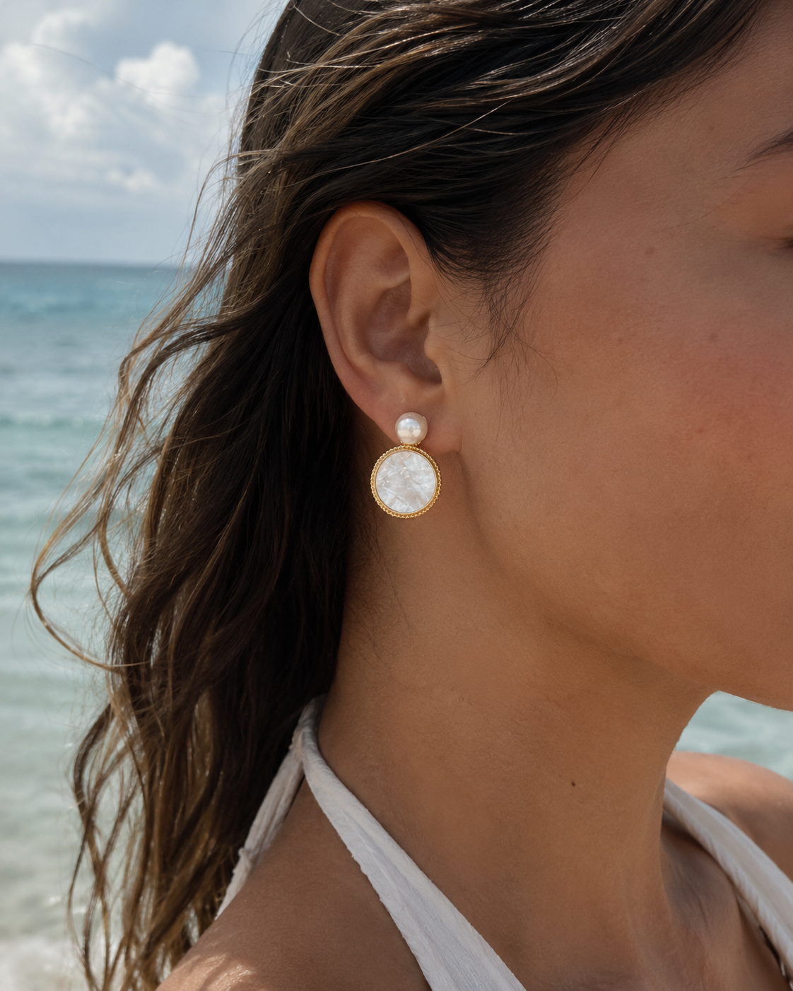 Styled view of Moonlit Shell Pearl Earrings by AURAM with shell-inspired pearl styling