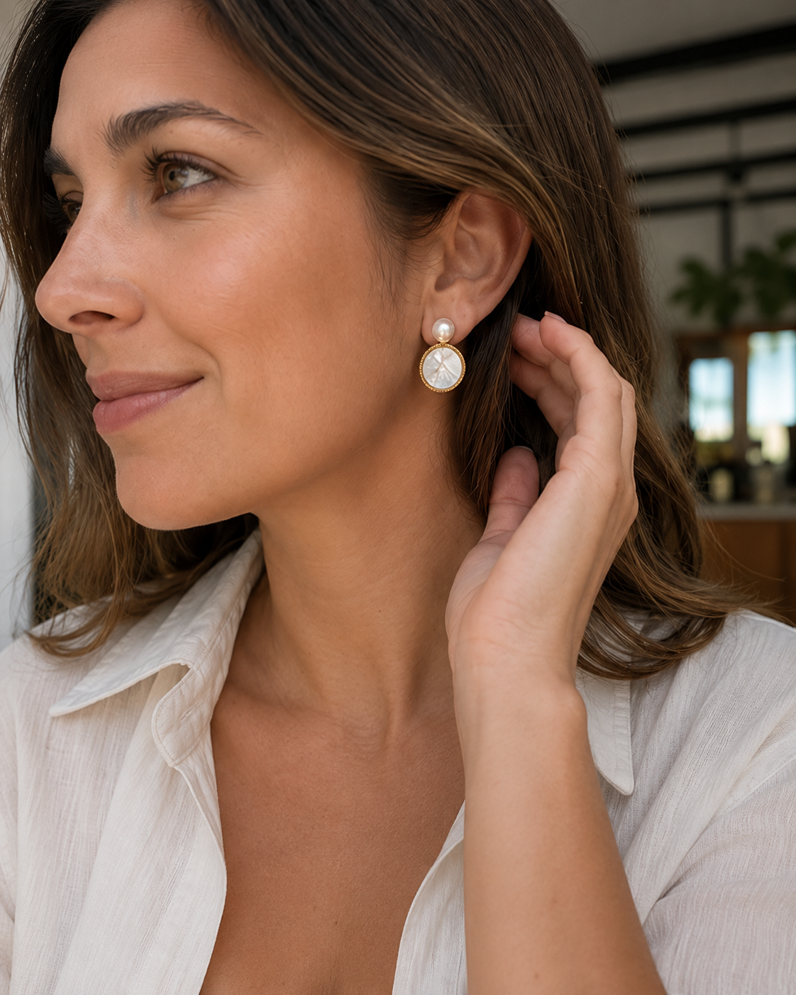 Detail view of Moonlit Shell Pearl Earrings by AURAM with shell-inspired pearl styling
