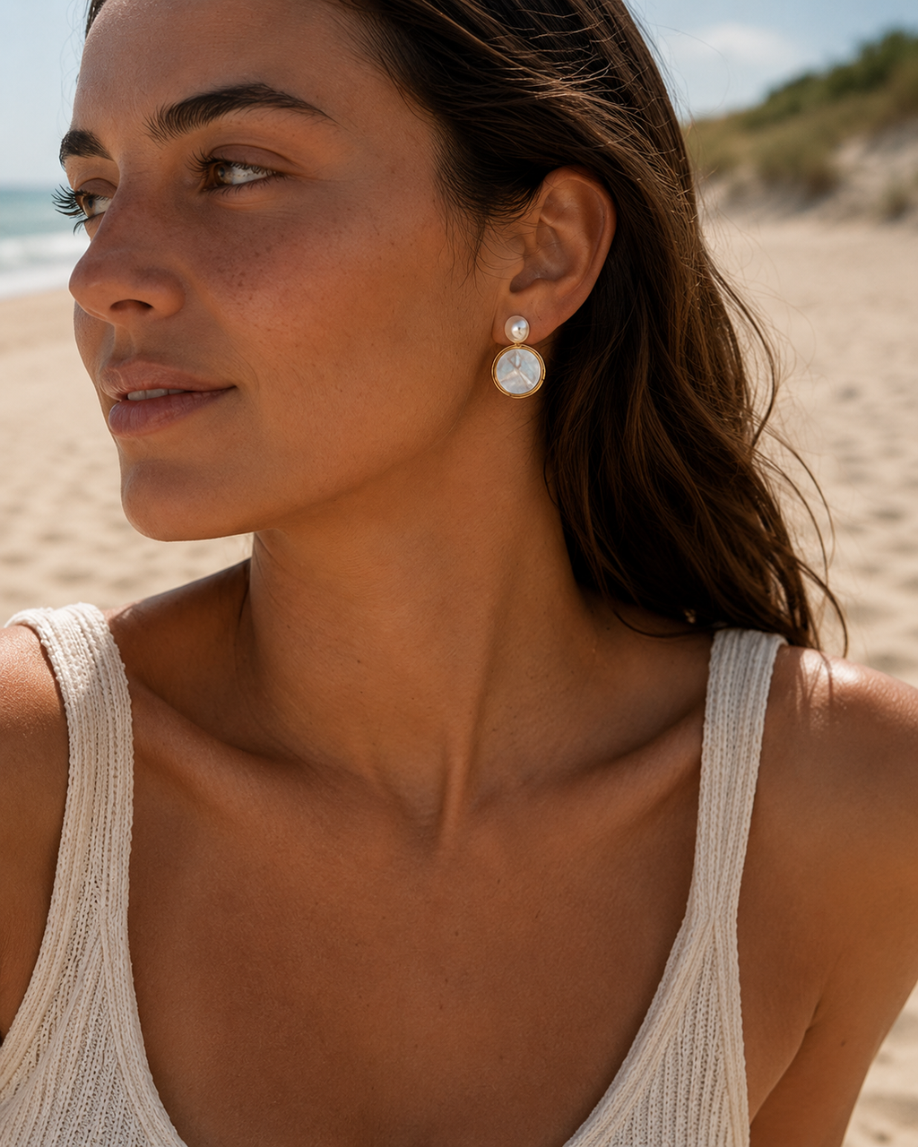 Detail view of Moonlit Shell Pearl Earrings by AURAM with shell-inspired pearl styling