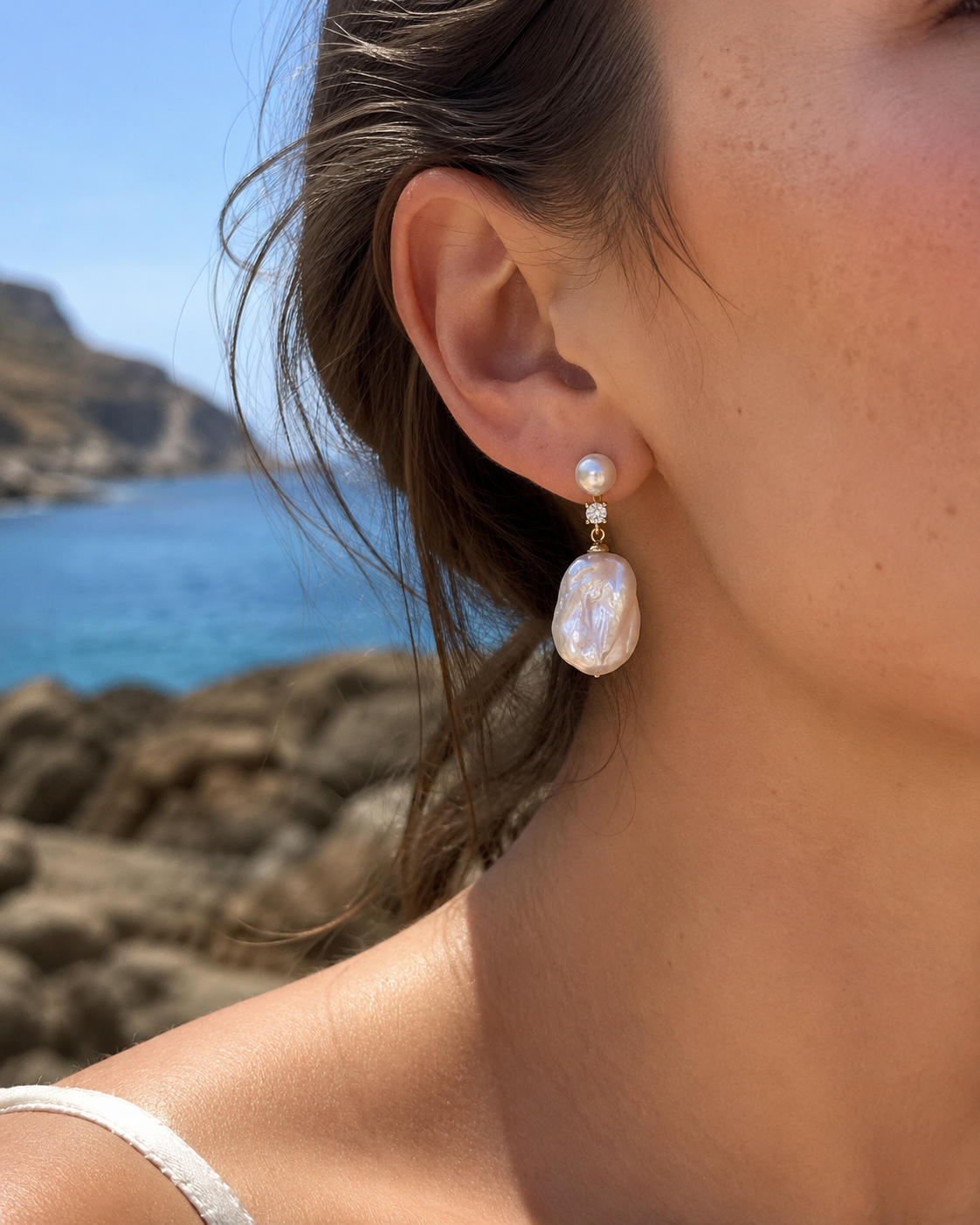 Styled view of Moon Tide Baroque Pearl Earrings by AURAM with moon-inspired baroque pearl detail