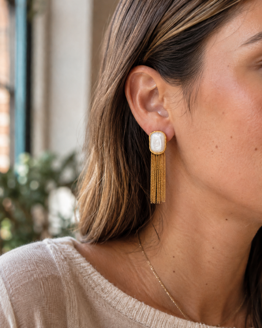 Styled view of Falling Light Baroque Pearl Tassel Earrings by AURAM with organic pearl drops