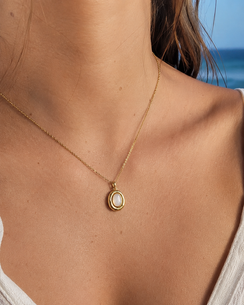 Additional view of Moon Cove Mother-of-Pearl Pendant Necklace by AURAM with moon-inspired shell pendant
