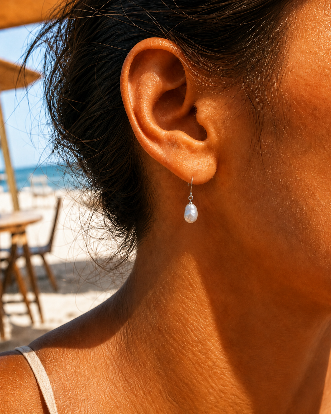 Styled view of Crescent Pearl Earrings by AURAM with moon-inspired pearl styling
