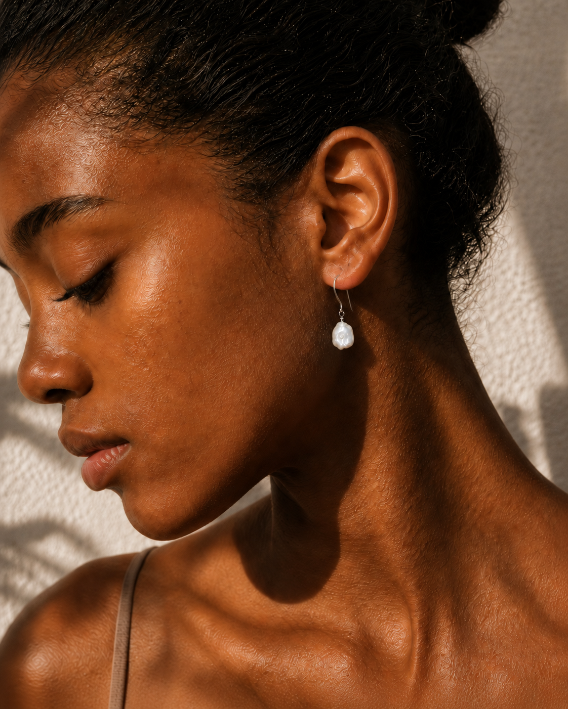 Alternate product view of Crescent Pearl Earrings by AURAM with moon-inspired pearl styling