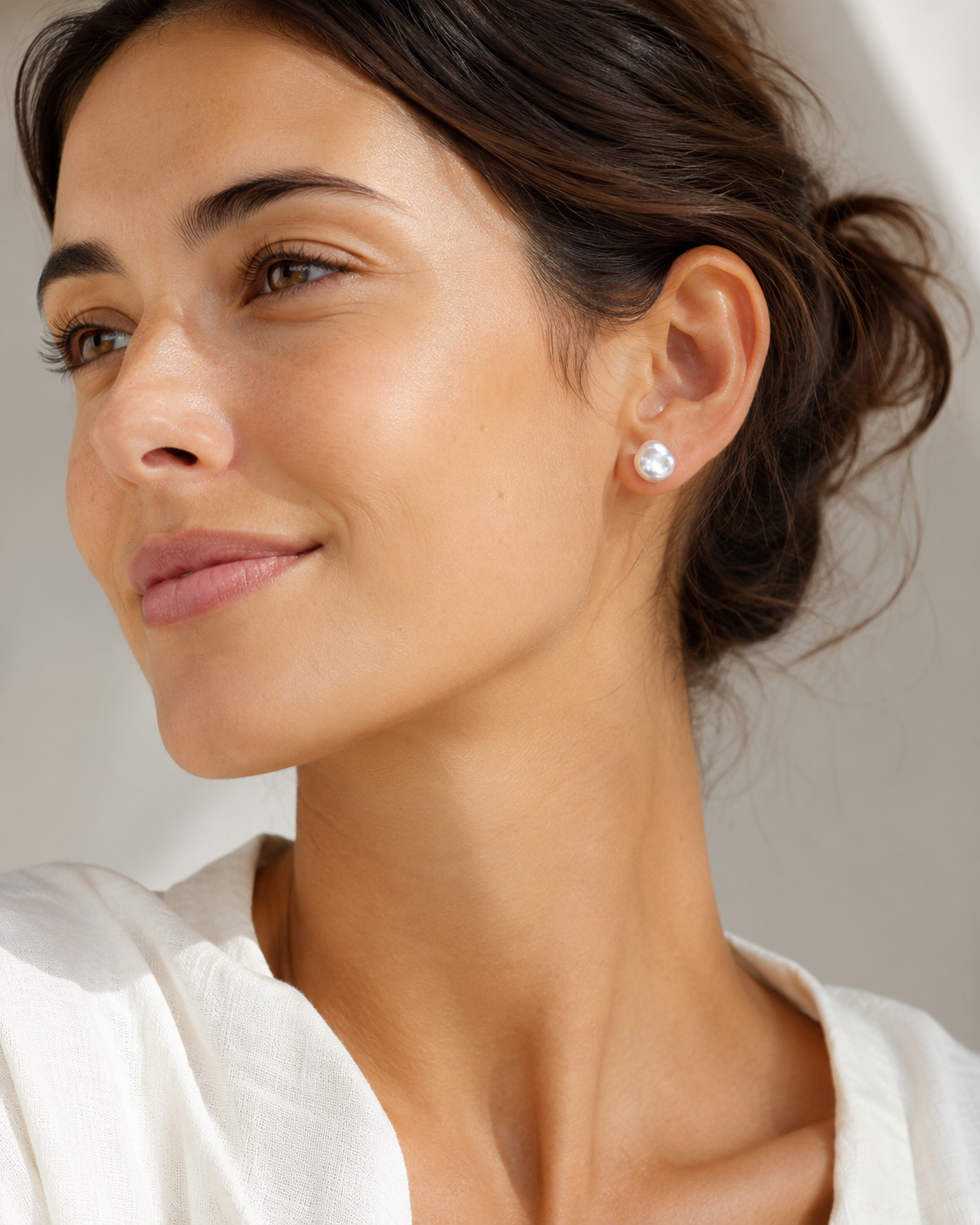 Additional view of Tiny Pearl Studs by AURAM, minimal everyday pearl stud earrings